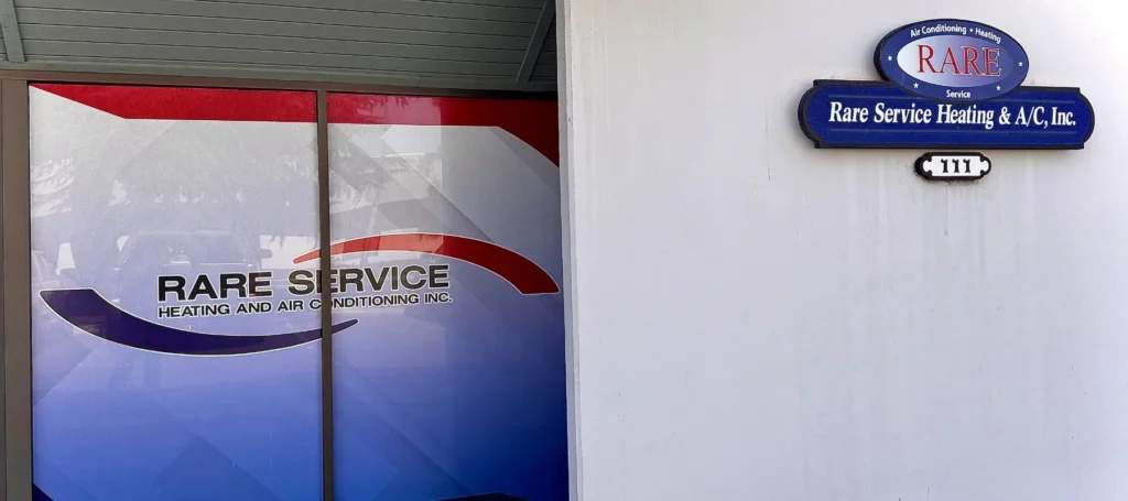 A storefront with Rare Service Heating and Air Conditioning Inc. on the window and a sign displaying the same name and street number 111 on the white wall.