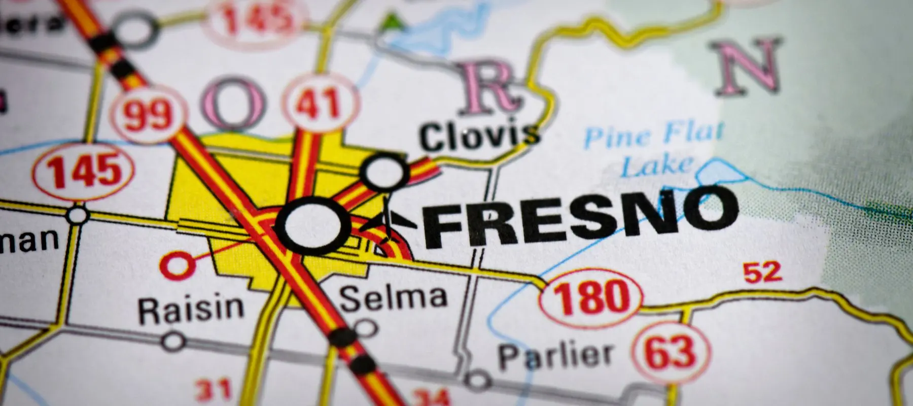 A close-up of a map showing Fresno, California, with nearby cities like Clovis, Selma, and Parlier, as well as highways 41, 99, and 180 intersecting. Pine Flat Lake is labeled to the northeast.